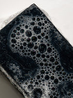 Close up of soapy Clarifying Bar Primally Pure - Non-toxic skincare
