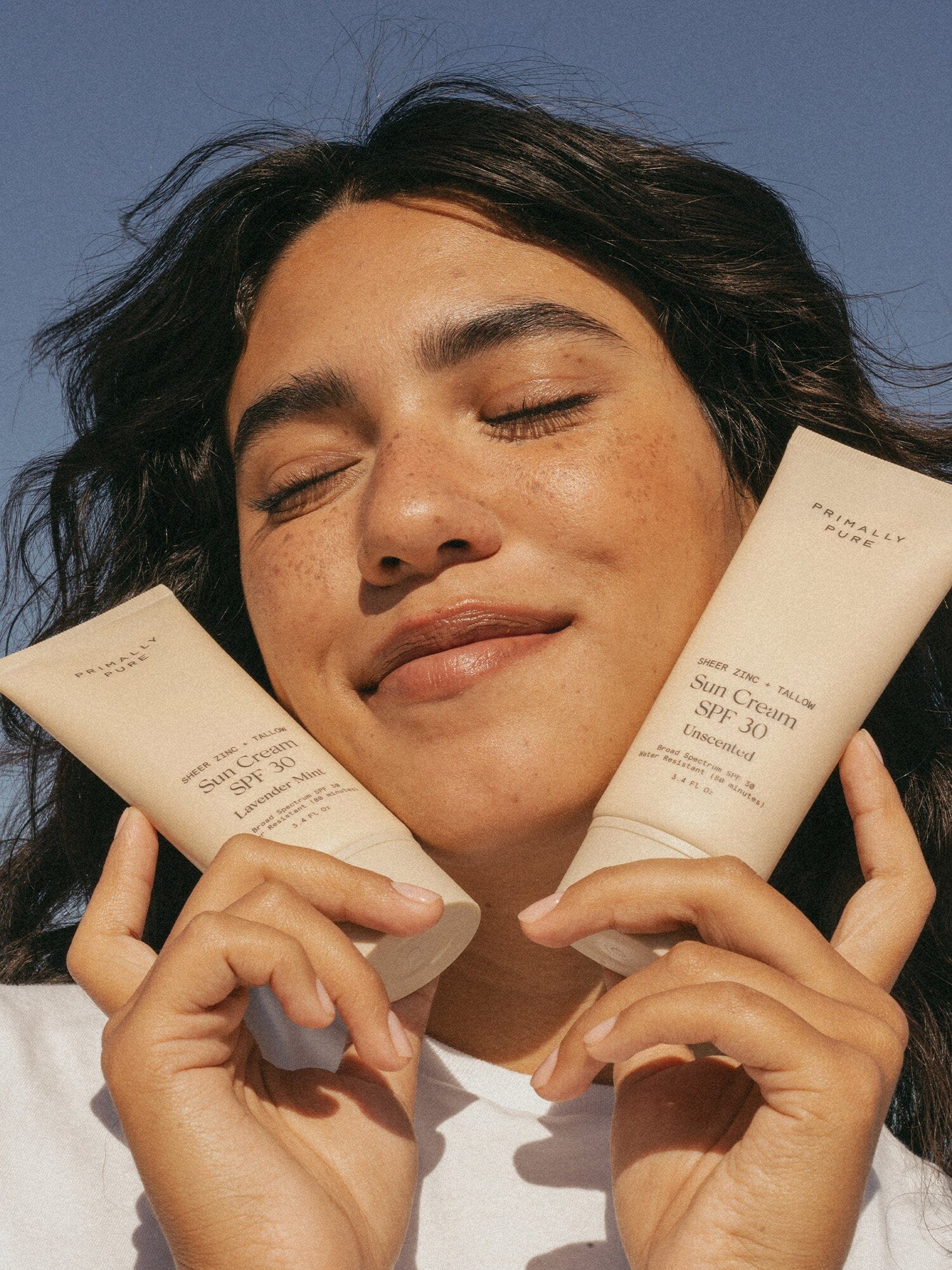 Sun Cream SPF 30 Sunscreen Primally Pure Model Holding Non-Toxic Sunscreen