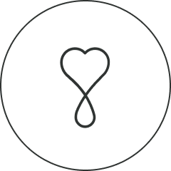 Heart symbol in a circular border to symbolize Primally Pure Happiness Guarantee Promise to customer satisfaction