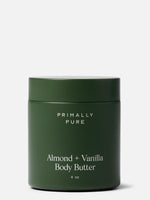 Primally Pure Almond + Vanilla Body Butter in a green 4 oz jar, showcasing the product's minimalist and natural packaging.