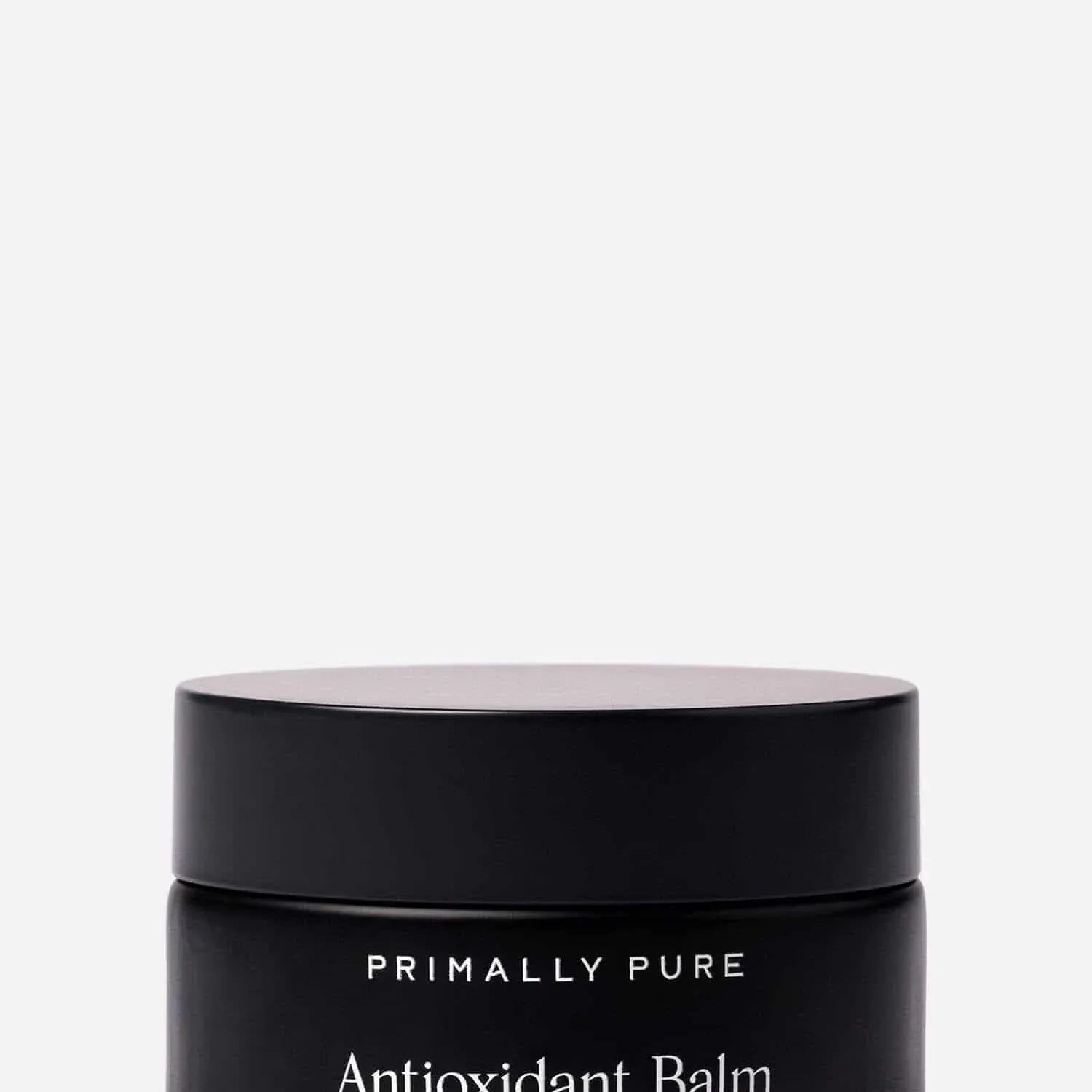 Black jar of Primally Pure Antioxidant Balm on a white background