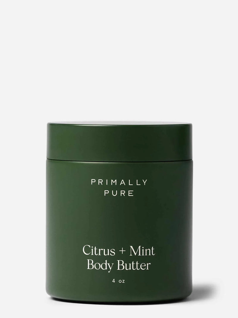 Green jar of Primally Pure Citrus + Mint Body Butter on a white background
