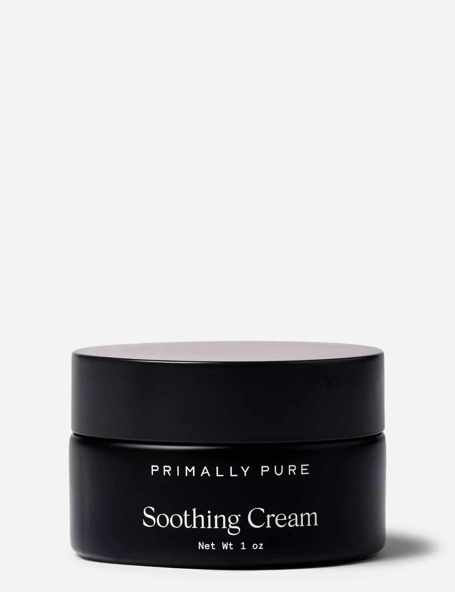 Black jar of Primally Pure Soothing Cream on a white background