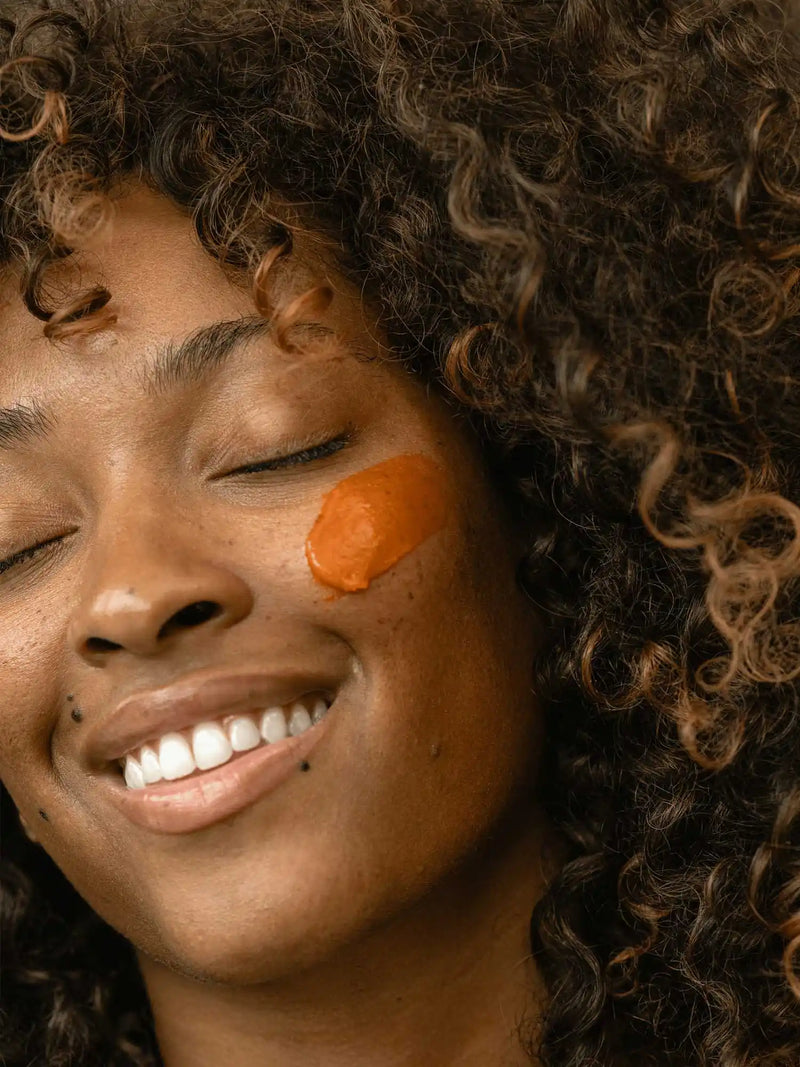 Antioxidant Balm Primally Pure on woman's face - Tallow skincare