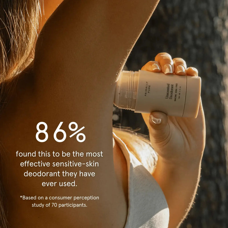 A person applying a deodorant stick to their underarm in warm sunlight.Unscented Deodorant (Baking Soda Free) Deodorant Primally Pure