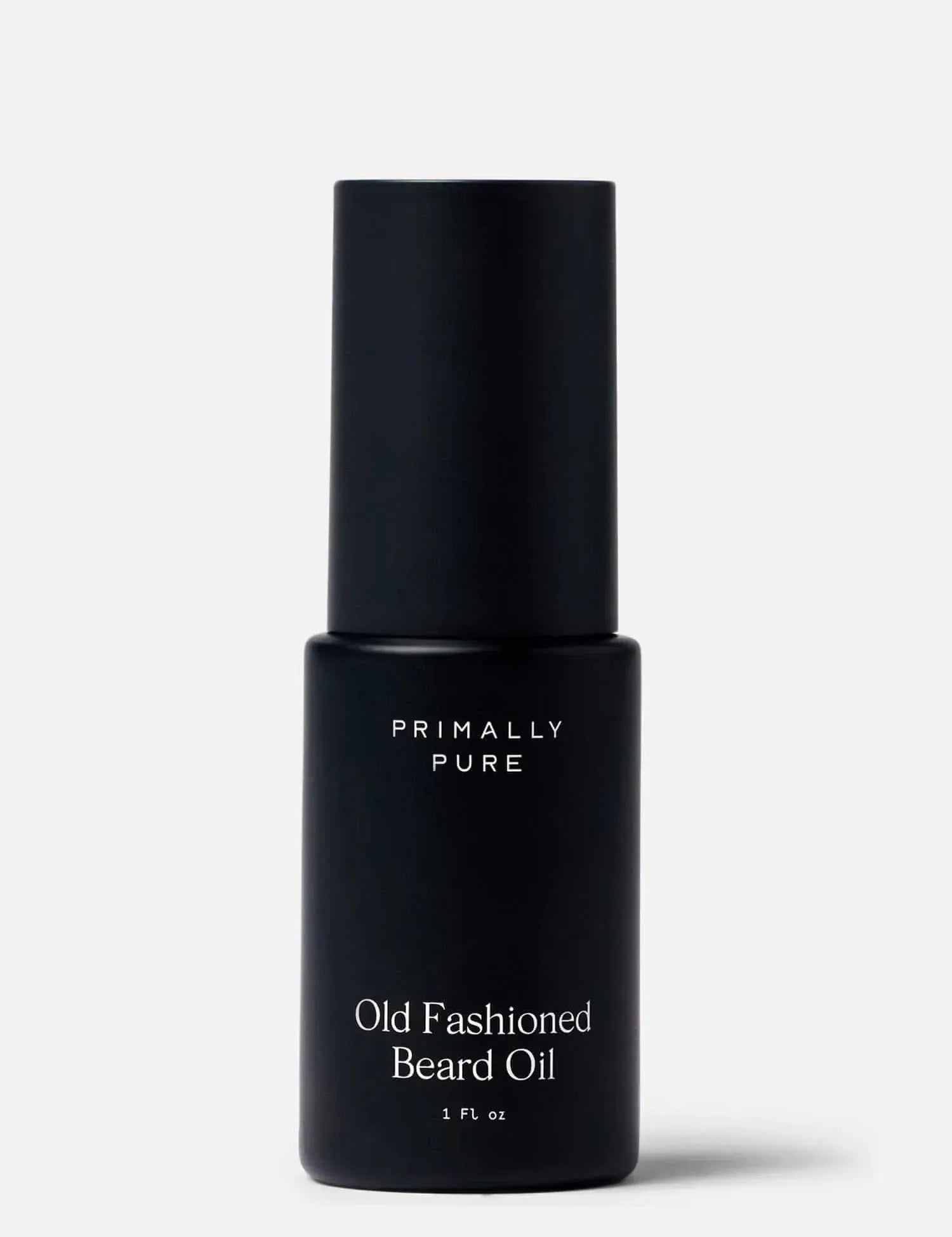 Black bottle of Primally Pure Old Fashioned Beard Oil on a white background