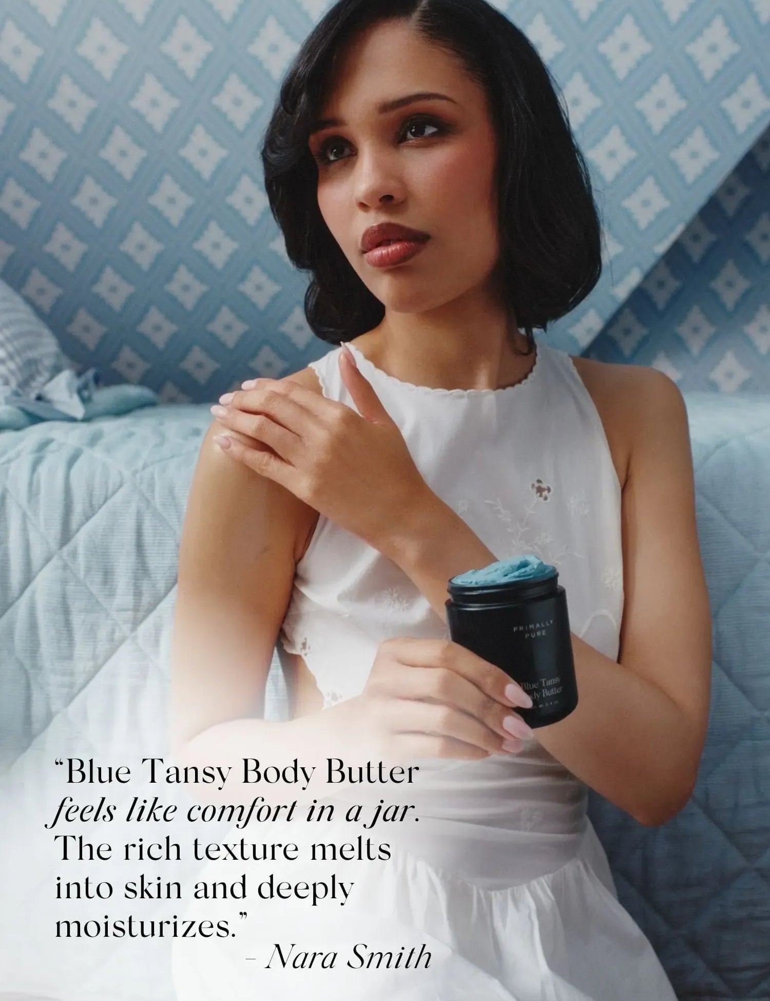 Nara Smith holding Primally Pure Blue Tansy Body Butter with a quote mentioning how Blue Tansy Body Butter feels like comfort in a jar.