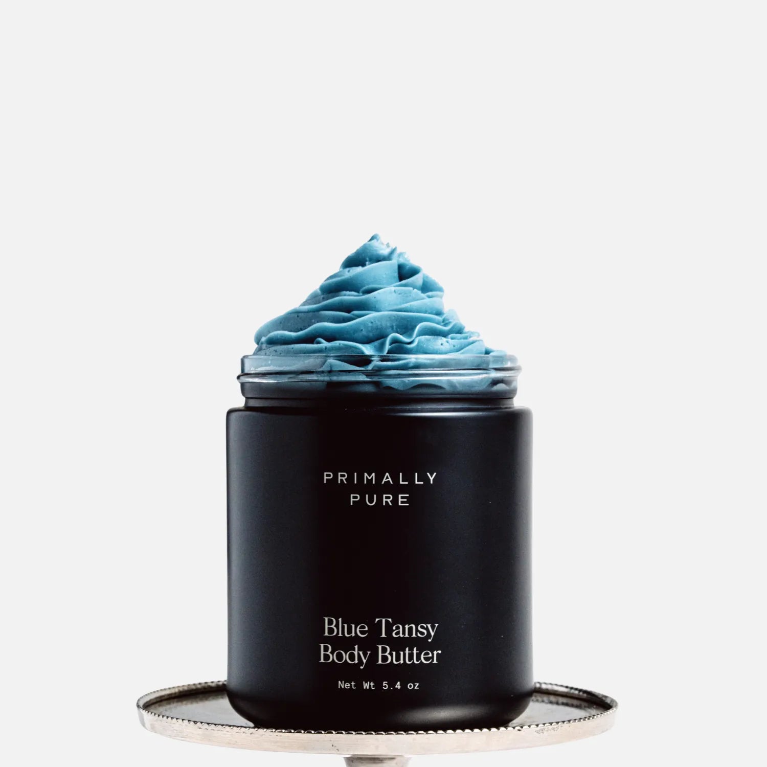 Jar of Primally Pure Blue Tansy Body Butter on a white background showing the butter-like texture of Blue Tansy Body Butter