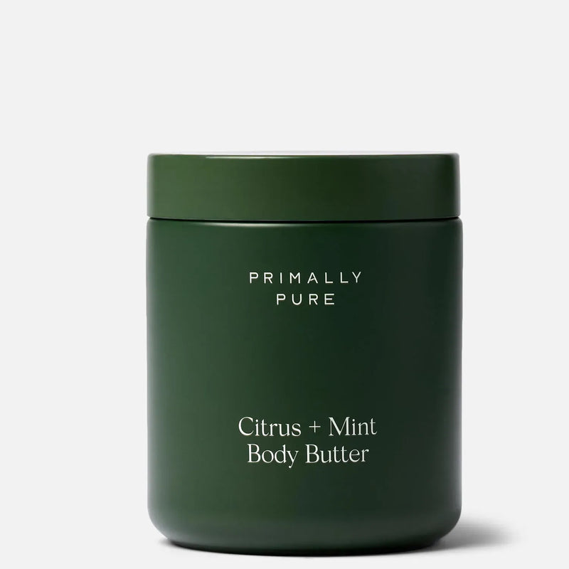 A dark green cylindrical jar of Primally Pure Large Citrus + Mint Body Butter on a light gray background.