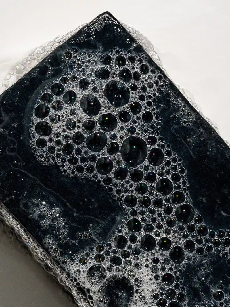 Close up of soapy Clarifying Bar Primally Pure - Non-toxic skincare