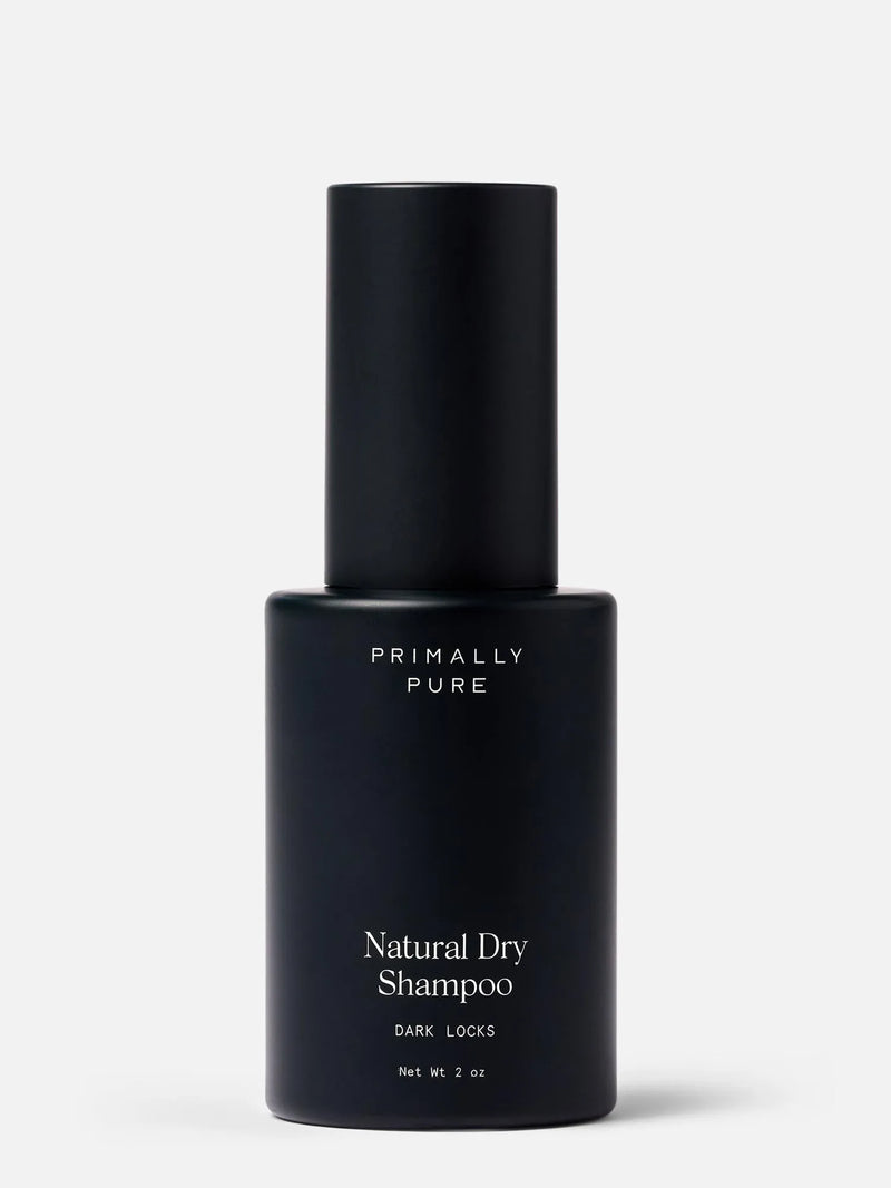 Black bottle of Primally Pure natural dry shampoo for dark hair on a white background