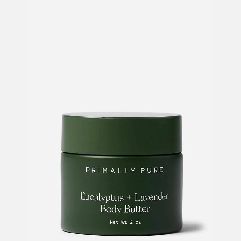 Primally Pure Eucalyptus + Lavender Body Butter in a dark green jar with a matching lid, set against a light gray background.