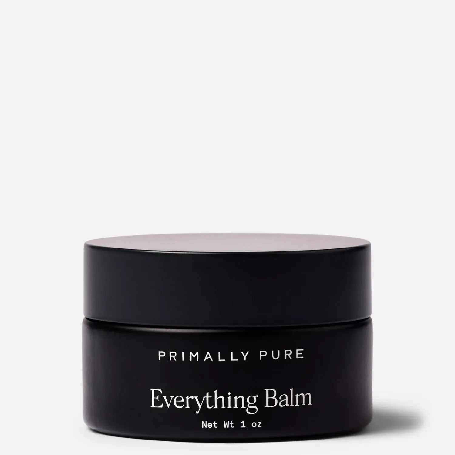 Black jar of Primally Pure Everything Balm, a tallow balm product, on a white background.
