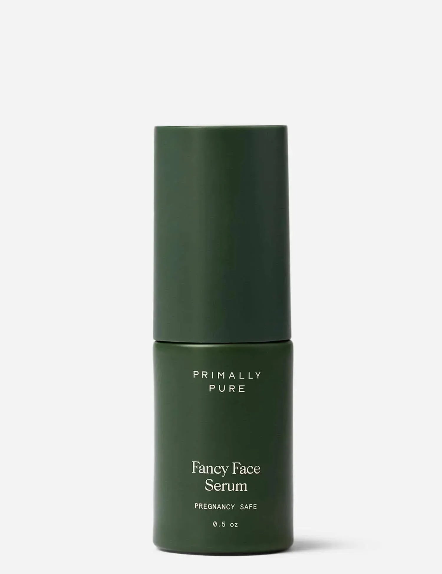 Green bottle of Primally Pure Fancy Face Serum on a white background