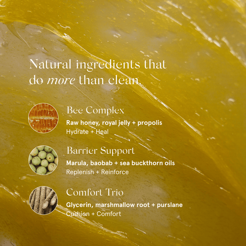 A close-up of Primally Pure Jelly to Milk Cleanser balm with white text reading 'Natural ingredients that do more than clean.' Below, three ingredient callouts are shown: Bee Complex with a honeycomb icon, Barrier Support with green oval icons, and Comfort Trio. 