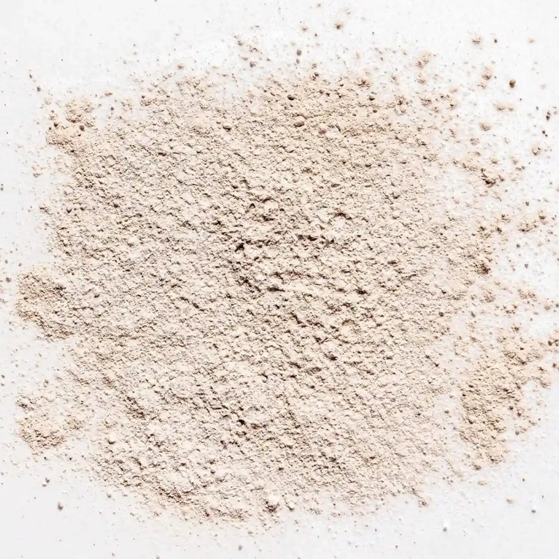 Powdered non-toxic dry shampoo on a white background, perfect for natural hair care from Primally Pure.