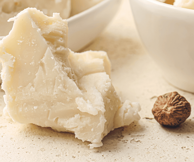 Natural shea butter chunks ready for use in moisturizing creams.